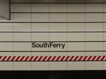 The station's name emblazoned on the wall. This is one of the few changes to the station that resulted from the post-Sandy restoration and repair. Originally the station names on the walls were significantly smaller. The new lettering reflects the lettering and sizing on other new stations in the New York City Subway system.